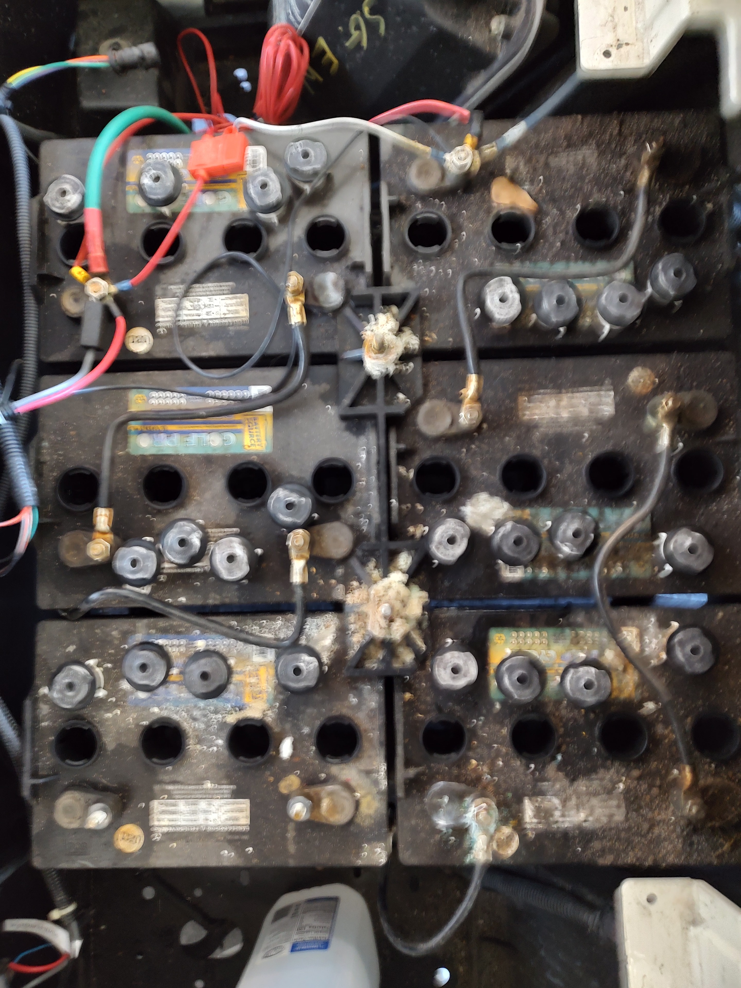 Corroded golf cart batteries before service